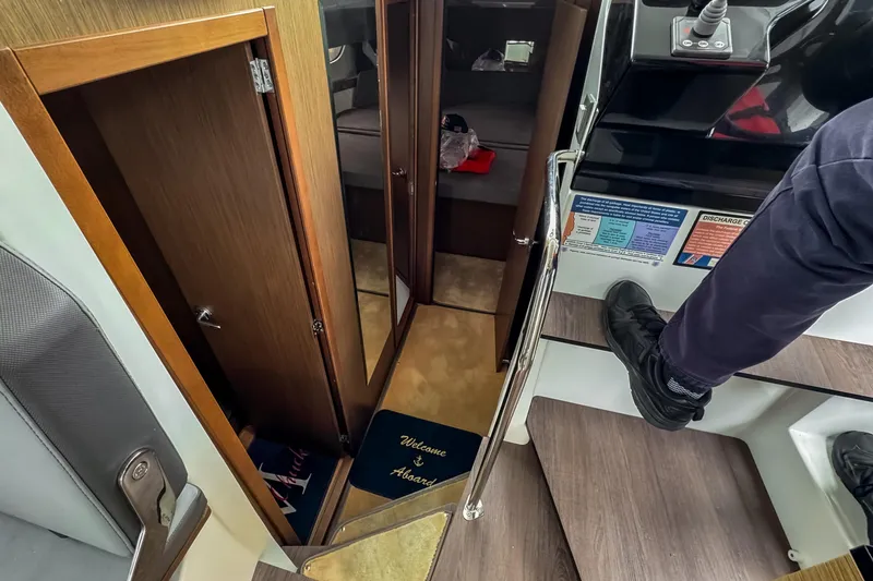  Yacht Photos Pics Interior view of 2022 Beneteau Antares 11 Fly, featuring stairs and cabin entrance.