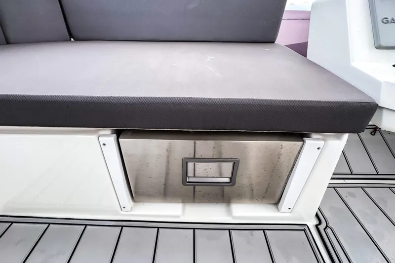  Yacht Photos Pics Beneteau Antares 11 Fly 2022 boat seat with storage drawer on deck.