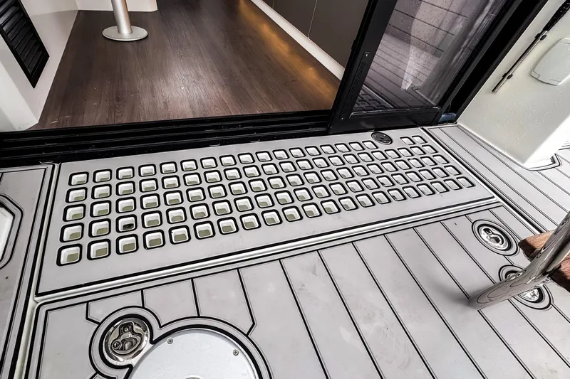  Yacht Photos Pics Beneteau Antares 11 Fly 2022 yacht deck with modern design and wood flooring.