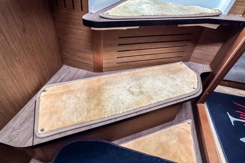  Yacht Photos Pics Wooden interior stairs with beige carpet in 2022 Beneteau Antares 11 Fly.