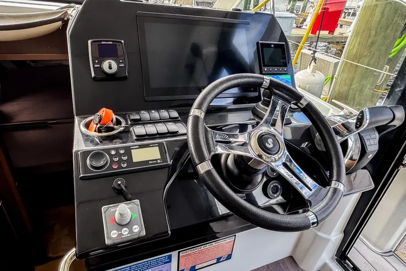  Yacht Photos Pics Helm of 2022 Beneteau Antares 11 Fly with modern controls and navigation equipment.