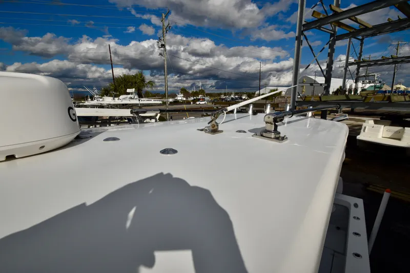  Yacht Photos Pics 2023 Pair Customs 24 Deep V boat at shipyard with cloudy sky.