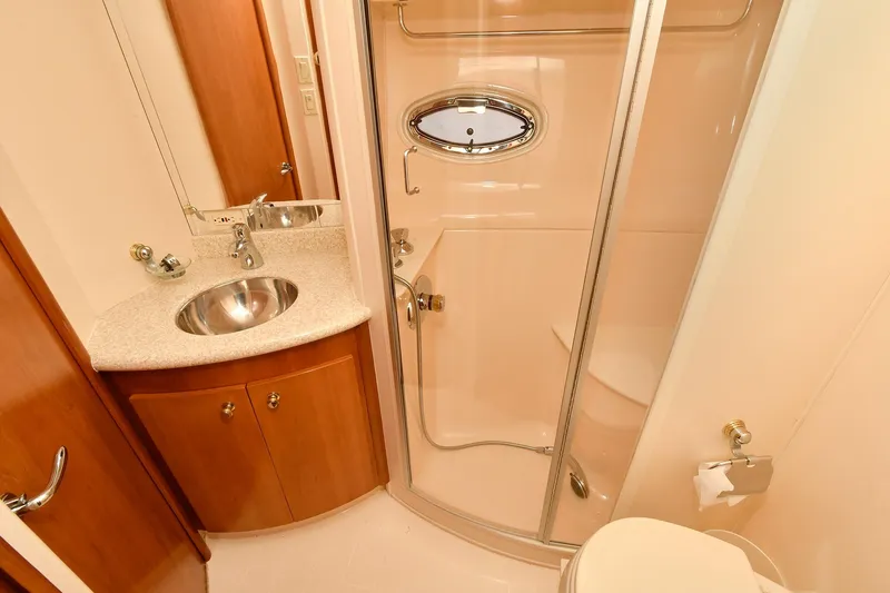  Yacht Photos Pics Luxurious bathroom in 2001 Carver 466 Motor Yacht with shower and sink.