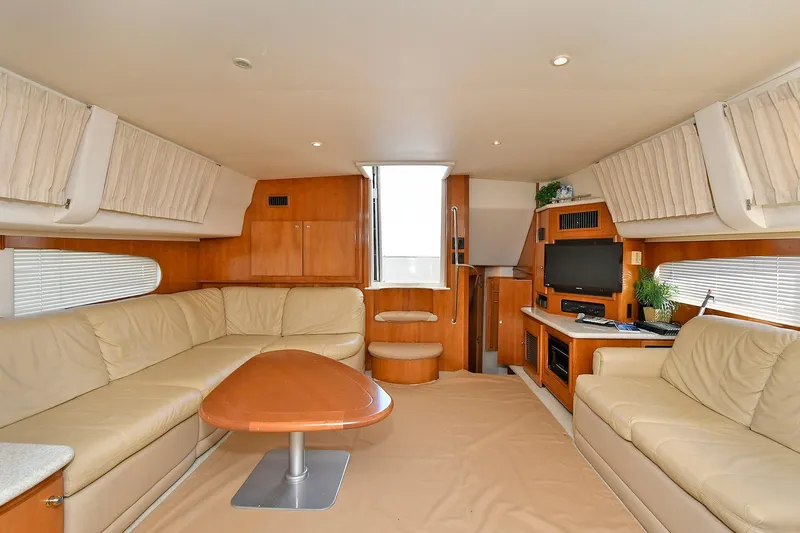  Yacht Photos Pics Luxurious interior of 2001 Carver 466 Motor Yacht with beige seating and wooden accents.