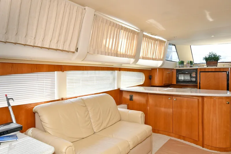  Yacht Photos Pics Luxurious interior of 2001 Carver 466 Motor Yacht with leather seating and modern kitchen.