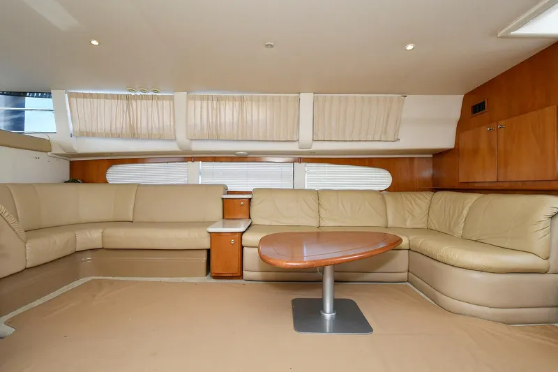  Yacht Photos Pics Luxurious interior of 2001 Carver 466 Motor Yacht with beige leather seating and wooden accents.