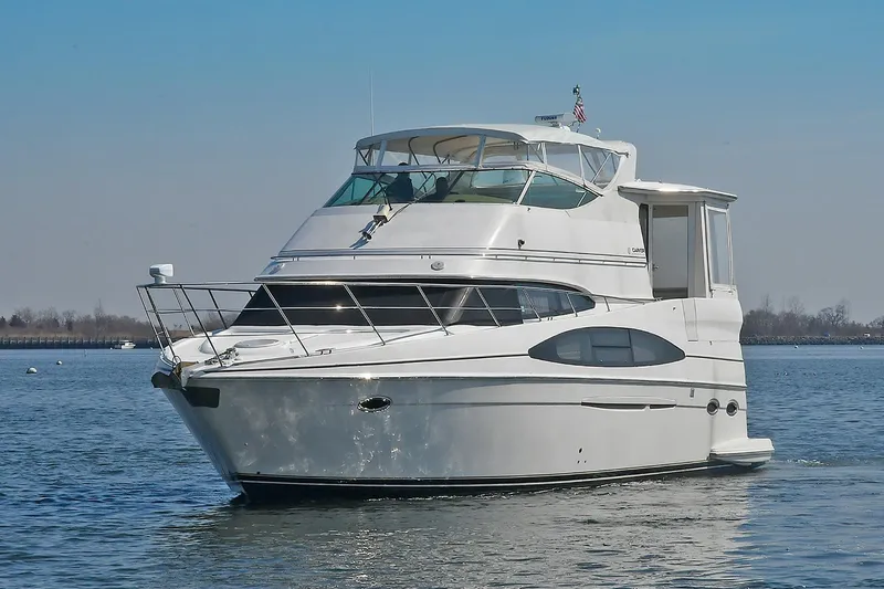  Yacht Photos Pics 2001 Carver 466 Motor Yacht on calm water, showcasing sleek design and spacious deck.