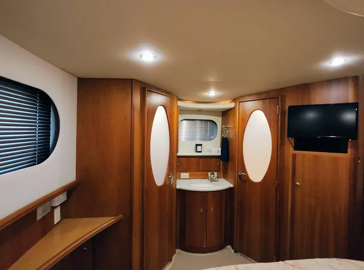 Diversion III Yacht Photos Pics Luxurious interior of 2002 Silverton 43 Motor Yacht with wood paneling and modern amenities.