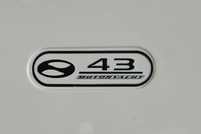 Diversion III Yacht Photos Pics Silverton 43 Motor Yacht 2002 emblem on white background.