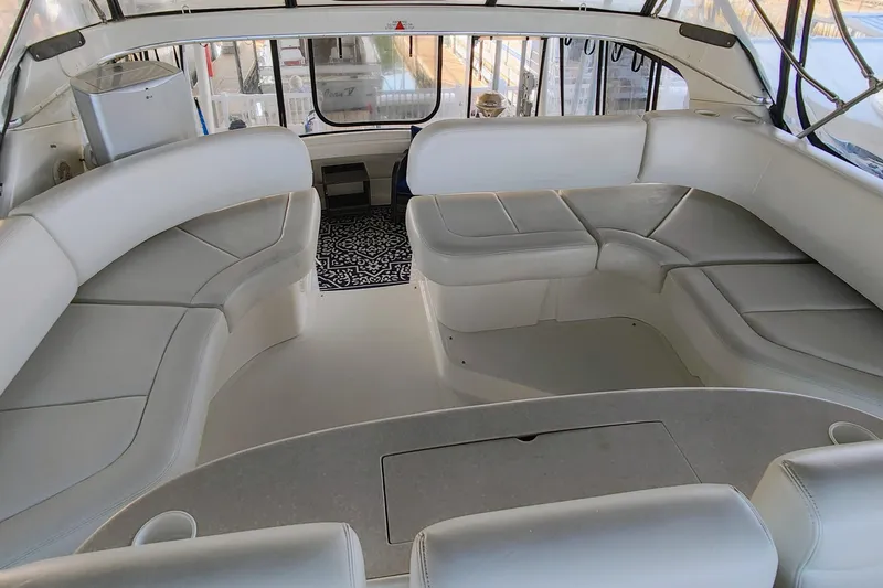 Diversion III Yacht Photos Pics 2002 Silverton 43 Motor Yacht interior with spacious white seating and elegant design.