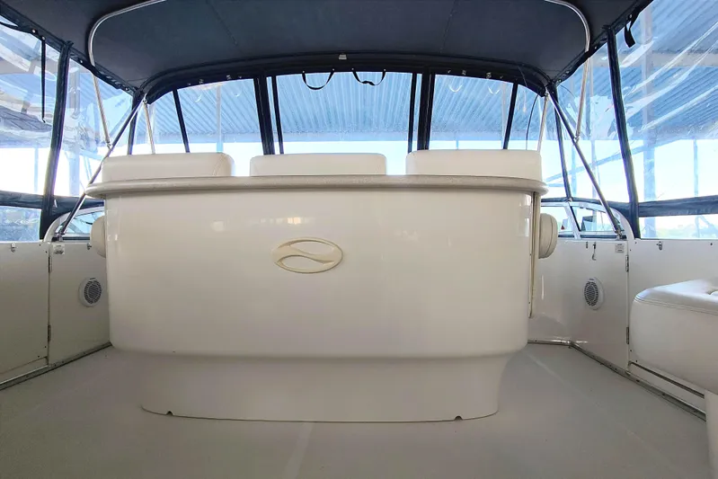 Diversion III Yacht Photos Pics 2002 Silverton 43 Motor Yacht interior with seating and helm, featuring a sleek design.