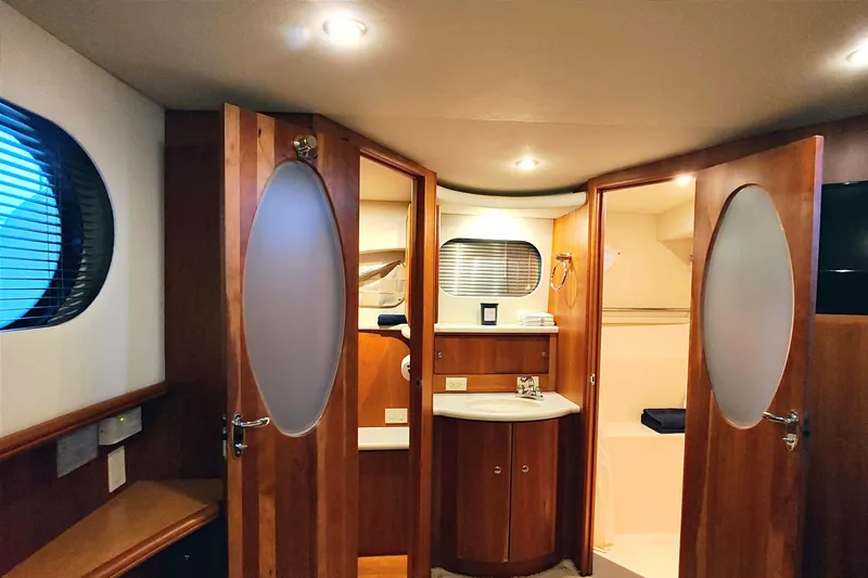 Diversion III Yacht Photos Pics Interior of 2002 Silverton 43 Motor Yacht with wood finish and modern amenities.
