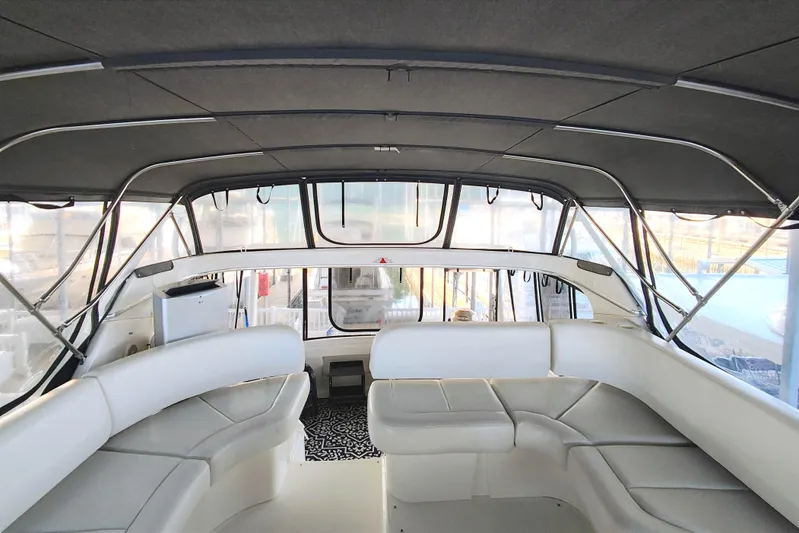 Diversion III Yacht Photos Pics Interior view of 2002 Silverton 43 Motor Yacht with spacious seating and panoramic windows.