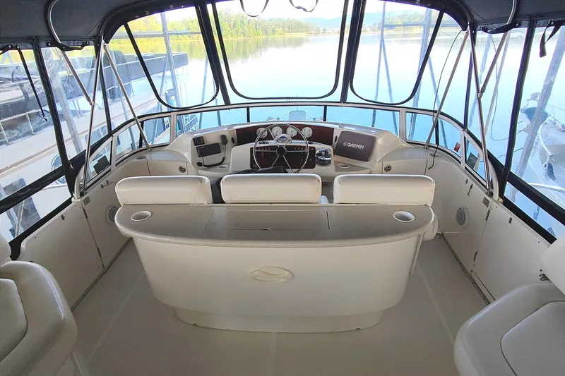 Diversion III Yacht Photos Pics Interior view of 2002 Silverton 43 Motor Yacht helm with panoramic water view.