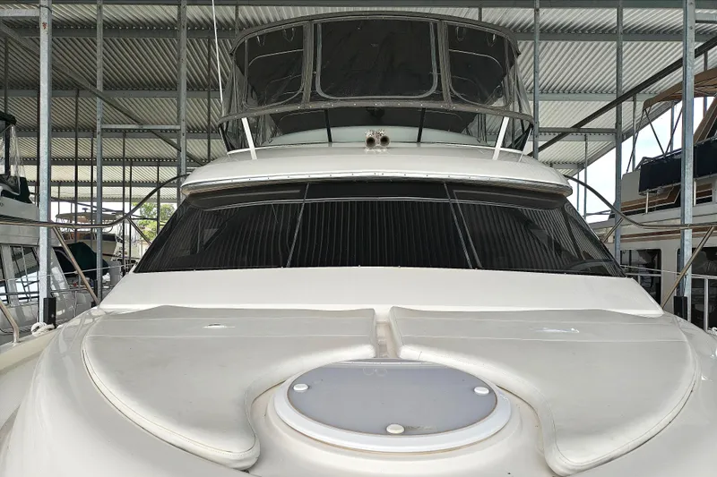 Diversion III Yacht Photos Pics 2002 Silverton 43 Motor Yacht in covered dock, front view.