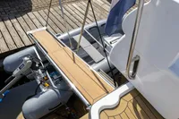 Elling E3 Ultimate 2004 yacht with wooden deck and inflatable dinghy at dock.