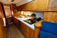 Luxurious 2004 Elling E3 Ultimate yacht kitchen with modern appliances and wooden cabinetry.