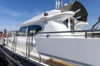 2004 Elling E3 Ultimate yacht, sleek design, docked under clear blue sky.
