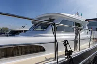2004 Elling E3 Ultimate yacht docked, showcasing sleek design and polished railings.