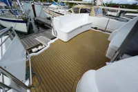 2004 Elling E3 Ultimate yacht deck with seating, docked at marina.