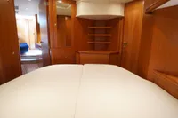 Luxurious cabin interior of 2004 Elling E3 Ultimate yacht with wooden finishes.
