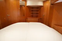 Luxurious cabin interior of 2004 Elling E3 Ultimate yacht with wooden finish.