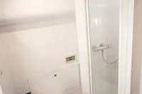 Bathroom interior of 2004 Elling E3 Ultimate yacht with shower and toilet.