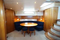 Luxurious 2004 Elling E3 Ultimate yacht interior with elegant wood finish and cozy seating area.