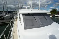 2004 Elling E3 Ultimate yacht docked at marina, showcasing sleek design and spacious deck.