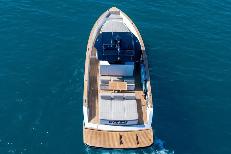 M/y Fizzy Yacht Photos Pics 2021 Pardo 43 luxury yacht cruising on clear blue water, aerial view.