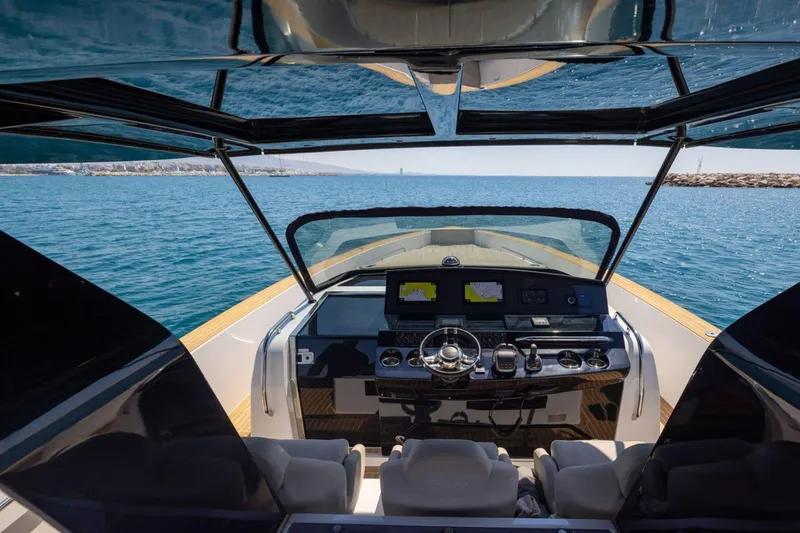 M/y Fizzy Yacht Photos Pics Cockpit view of 2021 Pardo 43 yacht with modern navigation equipment on open water.