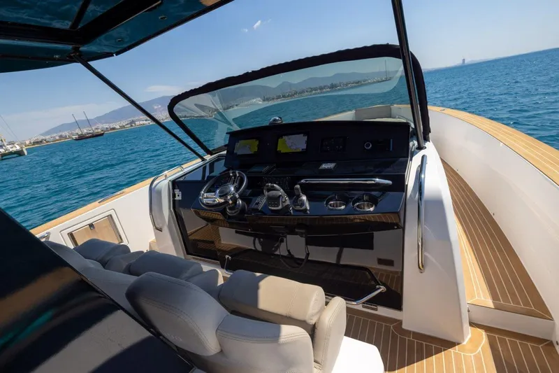 M/y Fizzy Yacht Photos Pics Cockpit view of 2021 Pardo 43 yacht with modern controls and ocean backdrop.
