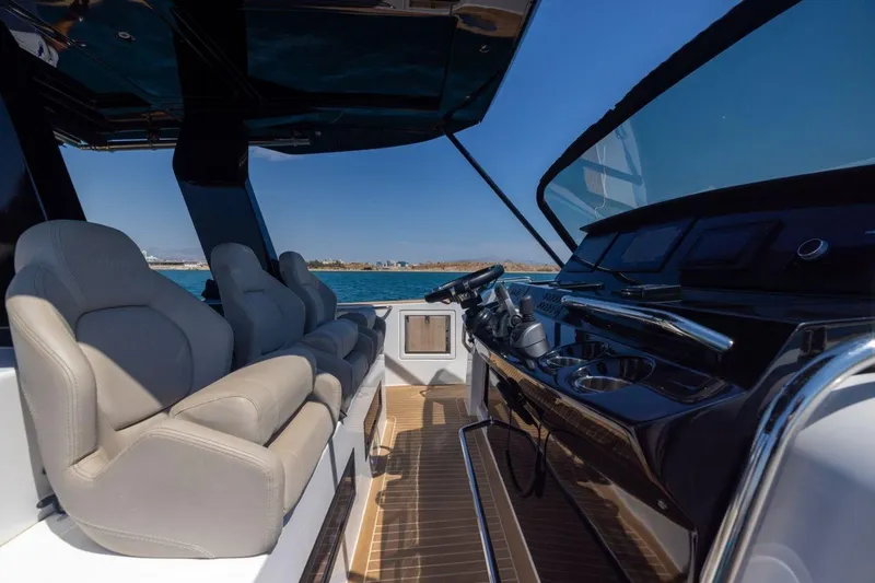 M/y Fizzy Yacht Photos Pics Luxurious interior of 2021 Pardo 43 yacht with plush seating and sleek dashboard.
