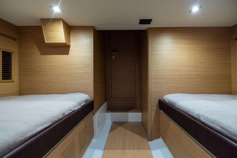 M/y Fizzy Yacht Photos Pics Interior cabin of 2021 Pardo 43 yacht with twin beds and wooden finish.
