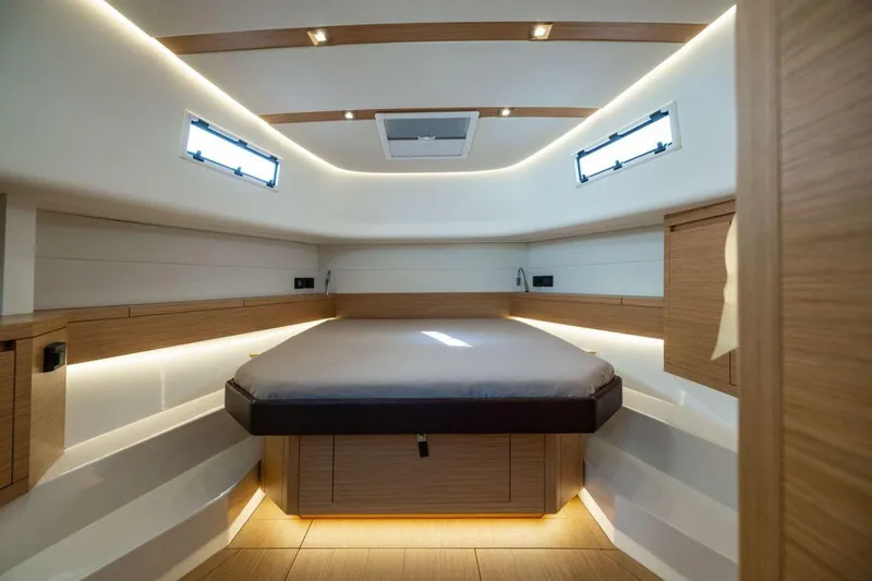 M/y Fizzy Yacht Photos Pics Luxurious interior cabin of 2021 Pardo 43 yacht with modern wood finish and ambient lighting.