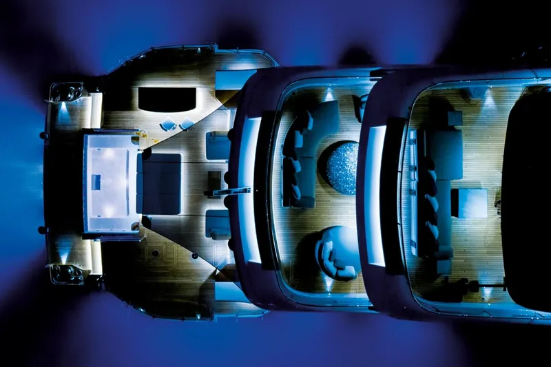  Yacht Photos Pics Aerial view of 2027 Benetti Oasis 40M yacht illuminated at night.