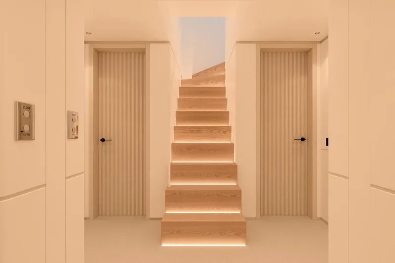  Yacht Photos Pics Luxurious interior of 2027 Benetti Oasis 40M yacht with illuminated wooden staircase.