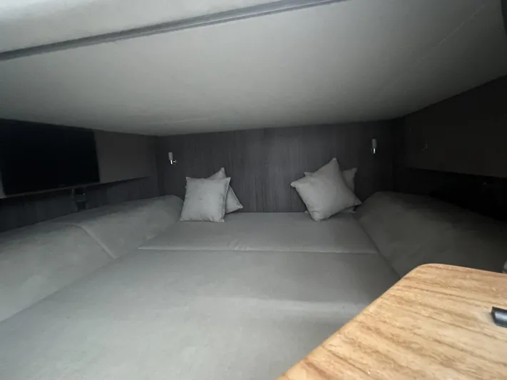 Sea Ray Slx 400 3x Mercury Ob Yacht Photos Pics Luxurious cabin interior of 2022 Sea Ray SLX 400 with cozy bedding and pillows.