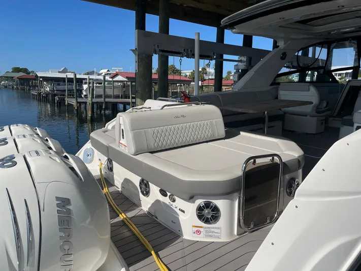 Sea Ray Slx 400 3x Mercury Ob Yacht Photos Pics 2022 Sea Ray SLX 400 boat docked, featuring spacious seating and Mercury engines.