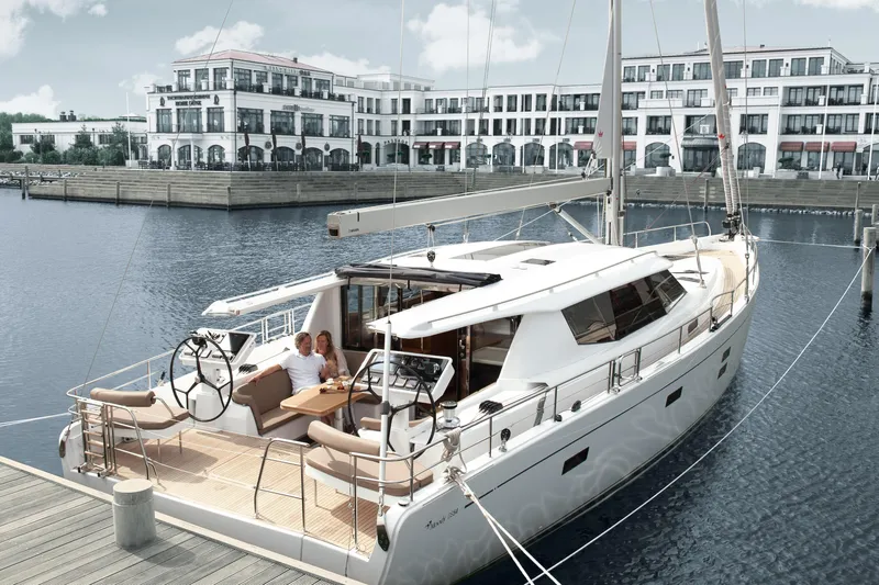  Yacht Photos Pics Luxury Moody DS 54 yacht docked at marina, 2026 model, with elegant waterfront backdrop.