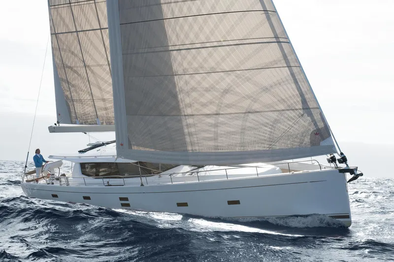  Yacht Photos Pics Sailing yacht Moody DS 54, 2026 model, navigating ocean waves under full sail.