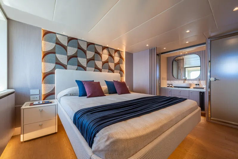  Yacht Photos Pics Luxurious bedroom interior on 2026 Absolute Navetta 62 yacht, featuring modern design and elegant decor.