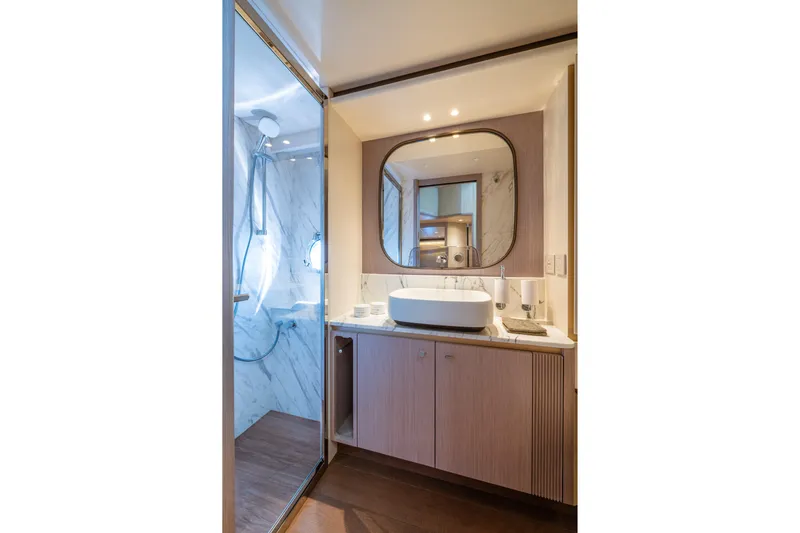  Yacht Photos Pics Luxurious bathroom in 2026 Absolute Navetta 62 yacht, featuring modern design and elegant fixtures.