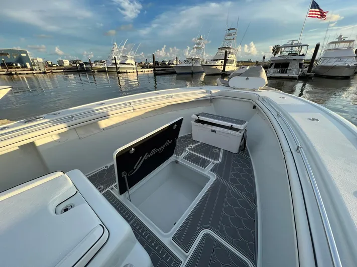 Saltwater Lady Yacht Photos Pics 2016 Yellowfin 42 boat docked at marina, featuring spacious deck and storage.