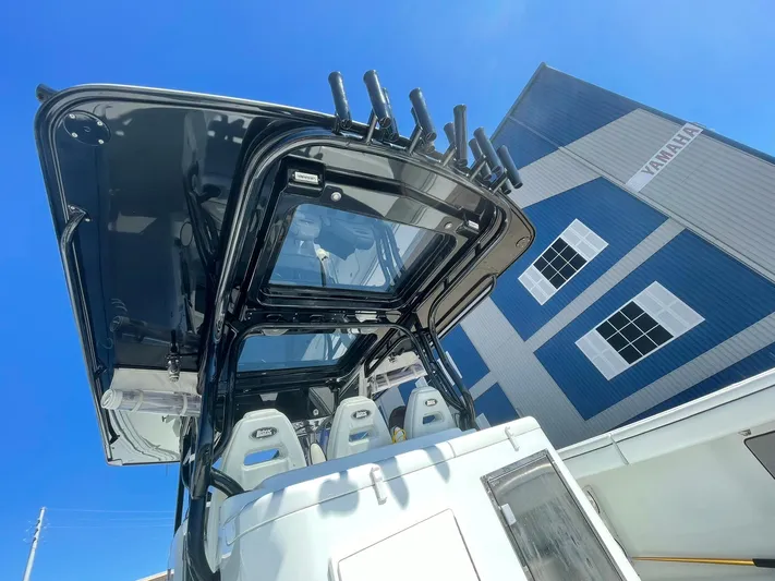 Saltwater Lady Yacht Photos Pics 2016 Yellowfin 42 boat with T-top, viewed from below against a blue sky.