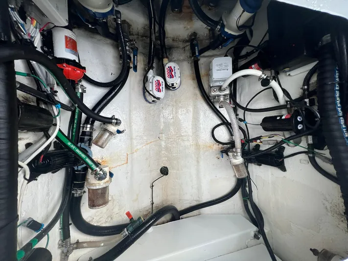 Saltwater Lady Yacht Photos Pics Engine compartment of a 2016 Yellowfin 42 boat, showcasing wiring and components.