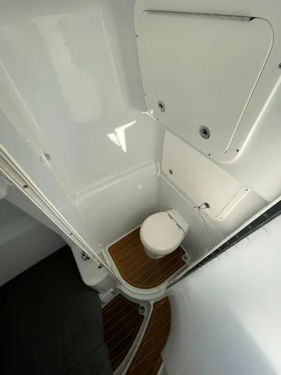 Saltwater Lady Yacht Photos Pics 2016 Yellowfin 42 boat interior bathroom with wooden flooring.