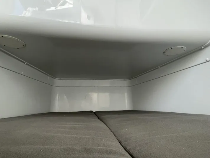 Saltwater Lady Yacht Photos Pics Interior cabin of 2016 Yellowfin 42 boat with cushioned seating.