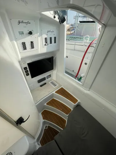 Saltwater Lady Yacht Photos Pics 2016 Yellowfin 42 boat interior with control panel and seating area.