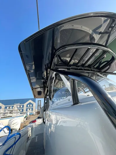 Saltwater Lady Yacht Photos Pics 2016 Yellowfin 42 boat with sleek design and modern features, docked under clear blue sky.